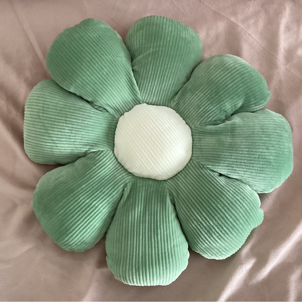 Green and white flower pillow.